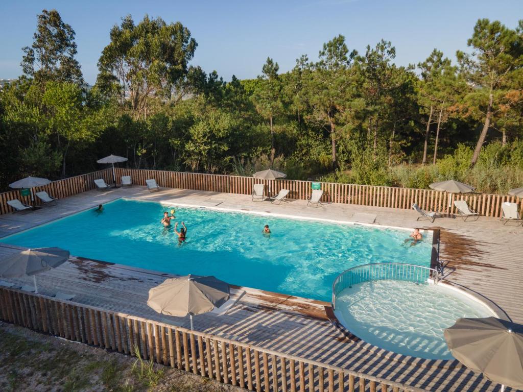 Stay at Huttopia Lagoa de Óbidos in Obidos, Portugal, 11 min walk to the Obidos Lagoon kitesurf spot.